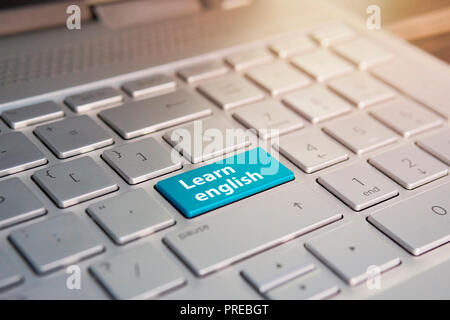 Laptop keyboard in closeup with learn english button as study of foreign language concept. Stock Photo