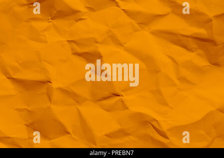 Orange background and wallpaper by crumpled paper, Orange crumpled paper texture with empty and free space for text, Background by scruffy paper textu Stock Photo