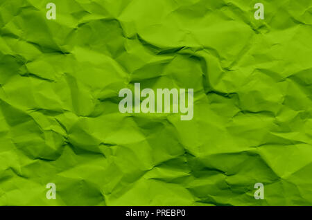 Green background and wallpaper by crumpled paper, Green crumpled paper texture with empty and free space for text, Background by scruffy paper texture Stock Photo
