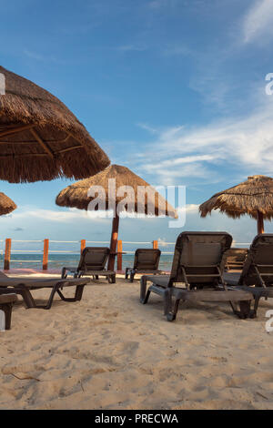Vacations by the sea are relaxing. An invitation to lounge and bask in the sun that is difficult to turn down. Nobody can resist a good book while lis Stock Photo