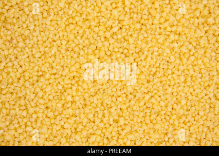 Background texture of couscous grains. Close up.  Top view. Stock Photo