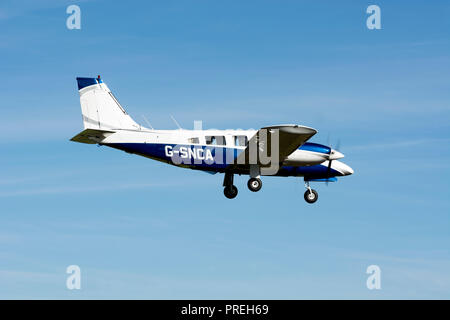 Piper PA-34-200T Seneca landing at Wellesbourne Airfield, Warwickshire, UK (G-SNCA) Stock Photo