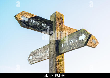 Signpost pointing to ' this way ' and  'that way' Stock Photo