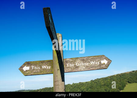 Signpost pointing to ' the other way ' Stock Photo