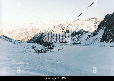 ski resort Shymbulak, Kazakhstan, Almaty, gondolas. cable car in the mountains. retro photo tinting Stock Photo