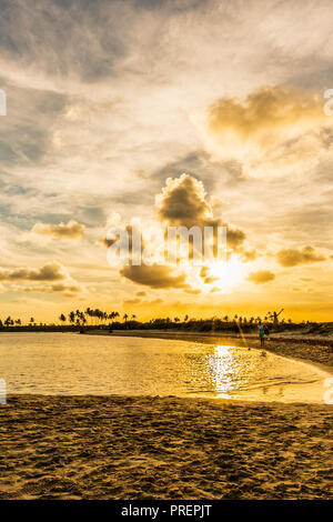 Scenic Tropical Sunset at Maracaipe Beach, near Porto de Galinhas Beach, in a beautiful blue sky day, Pernambuco, Brazil Stock Photo