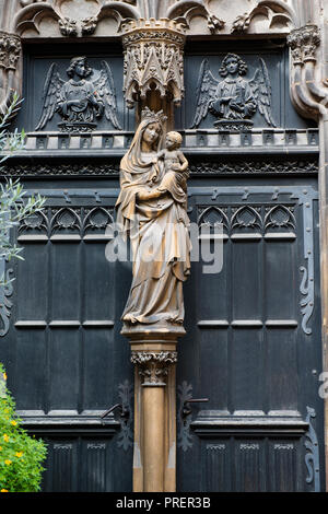 Holy Mary and Child carving on door Dominican Church, Colmar. Stock Photo