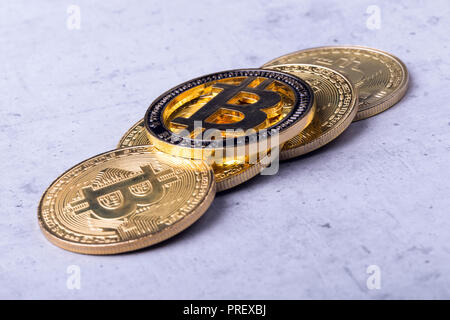 golden bitcoins on a concrete background, closeup photo Stock Photo