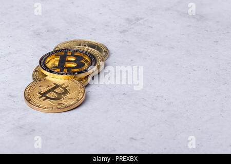 golden bitcoins on a concrete background, closeup photo Stock Photo