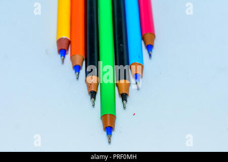 Set of multi-colored pens, tools for writing drawing, isolated on white. Stock Photo