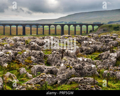 Arches of the Ribblead Viaduct striding across the valley on an overcast day at Ribblehead Yorkshire Dales England