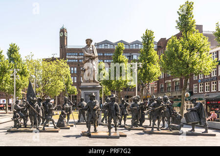 The cast iron statue of Rembrandt and the bronze-cast sculptures of his most famous painting, the Night Watch. Stock Photo