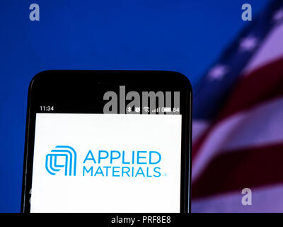 Applied Materials, Inc. logo seen displayed on smart phone. Applied Materials, Inc. is an American corporation that supplies equipment, services and software to enable the manufacture of semiconductor chips for electronics, flat panel displays for computers, smartphones and televisions, and solar products. Stock Photo