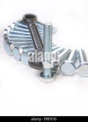 wrench bolts nuts on white background Stock Photo