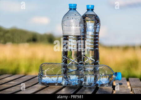 drinking water in plastic bottles outdoors Stock Photo
