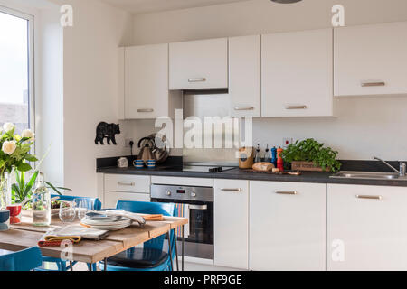 Retro style kitchen with scaffold board table Stock Photo