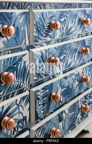 Upcycled chest of drawers with leaf pattern Stock Photo