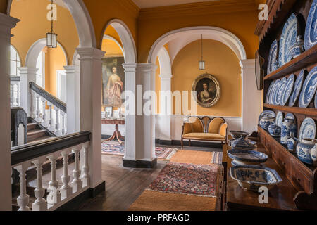 Sheraton style settee with 18th century portrait Stock Photo