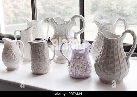 Collection of 19th and 20th century relief moulded jugs Stock Photo