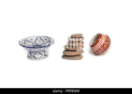 Pyramid  stone and Jug or jar ceramic  glaze on white background Stock Photo