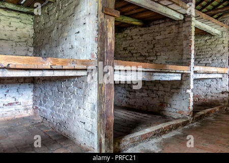 Prisoner's beds, bunks inside barrack in Auschwitz Birkenau. Nazi concentration camp Auschwitz II, Auschwitz Birkenau, Poland Stock Photo