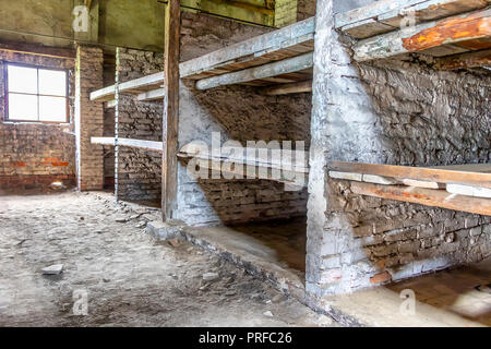 Prisoner's beds, bunks inside barrack in Auschwitz Birkenau. Nazi concentration camp Auschwitz II, Auschwitz Birkenau, Poland Stock Photo