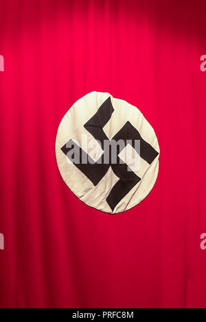 Krakow, Poland - June 3, 2018: Nazi Swastika - flag in Oskar Schindler's Enamel factory museum Stock Photo