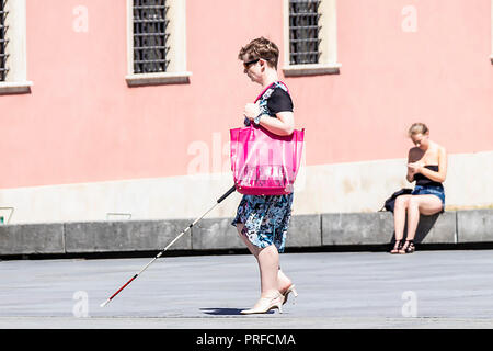 Warsaw, Poland May 31, 2018: Polish Blind woman walking near The Royal Castle of Warsaw in the city center. Poland Stock Photo