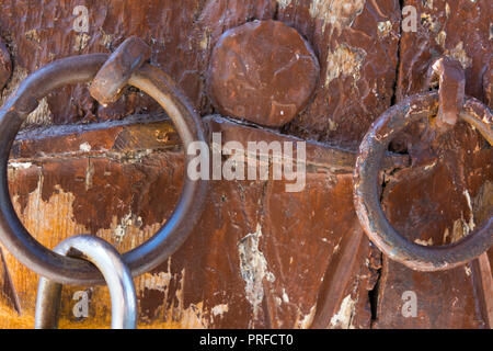Close up shot of an old ottoman door. Old rusty gate latch on the door Stock Photo