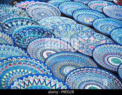 Decorative ceramic plates with traditional uzbekistan ornament on street market of Bukhara. Uzbekistan, Central Asia, Silk Road Stock Photo