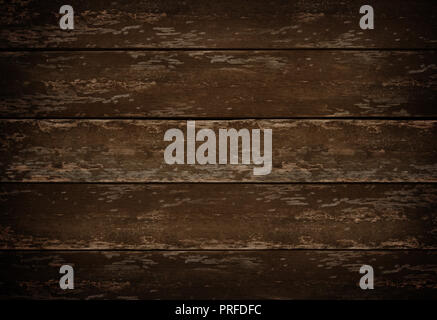 A dark and rustic wood table background, top down view. Stock Photo