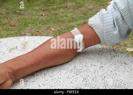 Bandage and gauze on an arm after a blood test :Select focus with shallow depth of field. Stock Photo