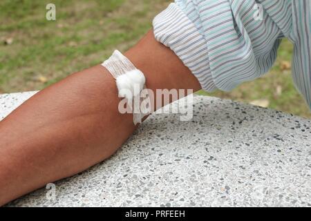 Bandage and gauze on an arm after a blood test :Select focus with shallow depth of field. Stock Photo