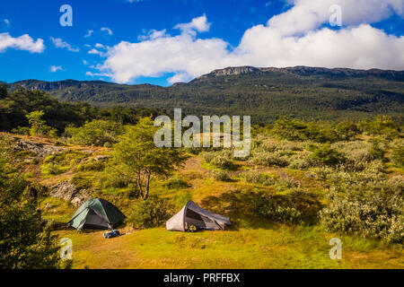 Green camping tent near a lake in Patagonia. Tierra del fuego National Park, Ushuaia. Sunny day Stock Photo