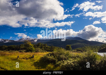 Green camping tent near a lake in Patagonia. Tierra del fuego National Park, Ushuaia. Sunny day Stock Photo