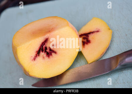 peack sliced on a board Stock Photo