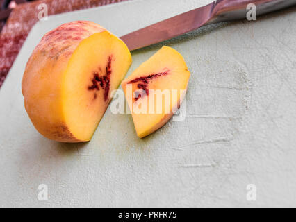 peack sliced on a board Stock Photo