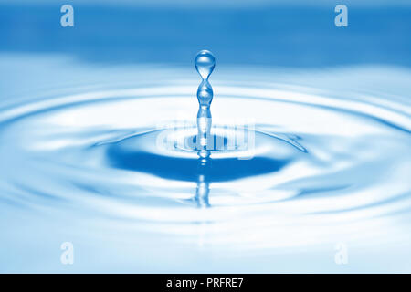 pure blue water droplet splash on water surface Stock Photo