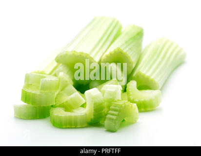 heap of green celery sticks isolated on white background Stock Photo