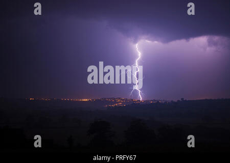 Lightning over Launceston town, Cornwall, UK Stock Photo
