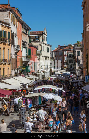 A busy street market on the island of Burano in the Venetian Lagoon near Venice, Italy. Stock Photo