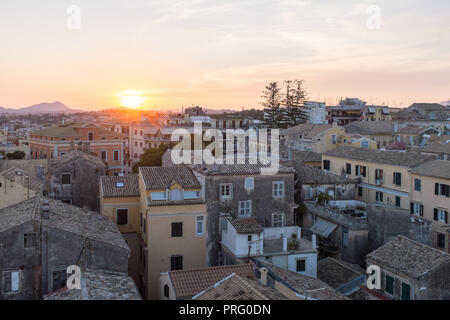 View over roof tops of Corfu Town at sunset Stock Photo