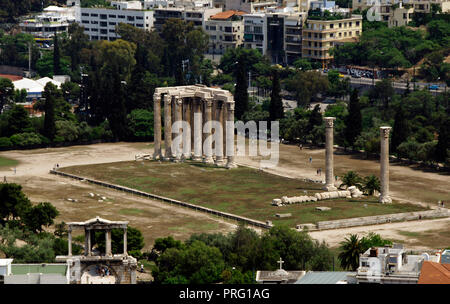 Greece. Athens. View of the Temple of Olympian Zeus. Although its construction began in the 6th century BC it was not finished until the reign of the emperor Hadrian, in the 2nd century, and was the largest temple in Greece in Hellenistic and Roman times. It was built in Pentelic marble, with 104 Corinthian columns. Only fifteen of them are conserved. Stock Photo