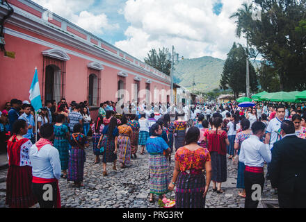 Guatemalan youths wearing traditional Mayan dress parade the streets for Independence Day in Antigua Guatemala Stock Photo