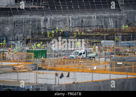 Construction workers fit reinforced concrete steel bars close to where the nuclear reactor will be housed at the EDF Energy Hinkley Point C nuclear power station in Somerset. Stock Photo