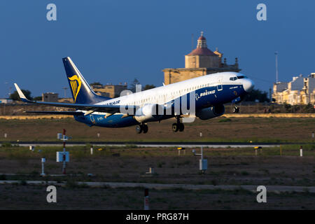 Ryanair Boeing 737-8AS [REG: EI-DCL] in special Boeing colors, taking off in the late evening. Stock Photo