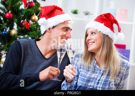 Happy couple celebrating christmas at home Stock Photo