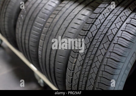 tires on sale.New Compact Vehicles Tires Stack. Winter and Summer Season Tires.Close up on all season car tires.Selective focus.Car service. all season car tires Stock Photo