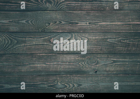 Background of wooden texture boards with remnants of dark paint. Stock Photo