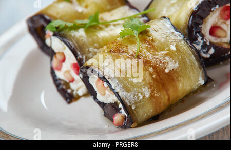 Badrijai Nigvzit, Georgian food , slices of eggplant  cooked paste of walnuts, vinegar, and spices is spread on the eggplant slices, which are then ro Stock Photo